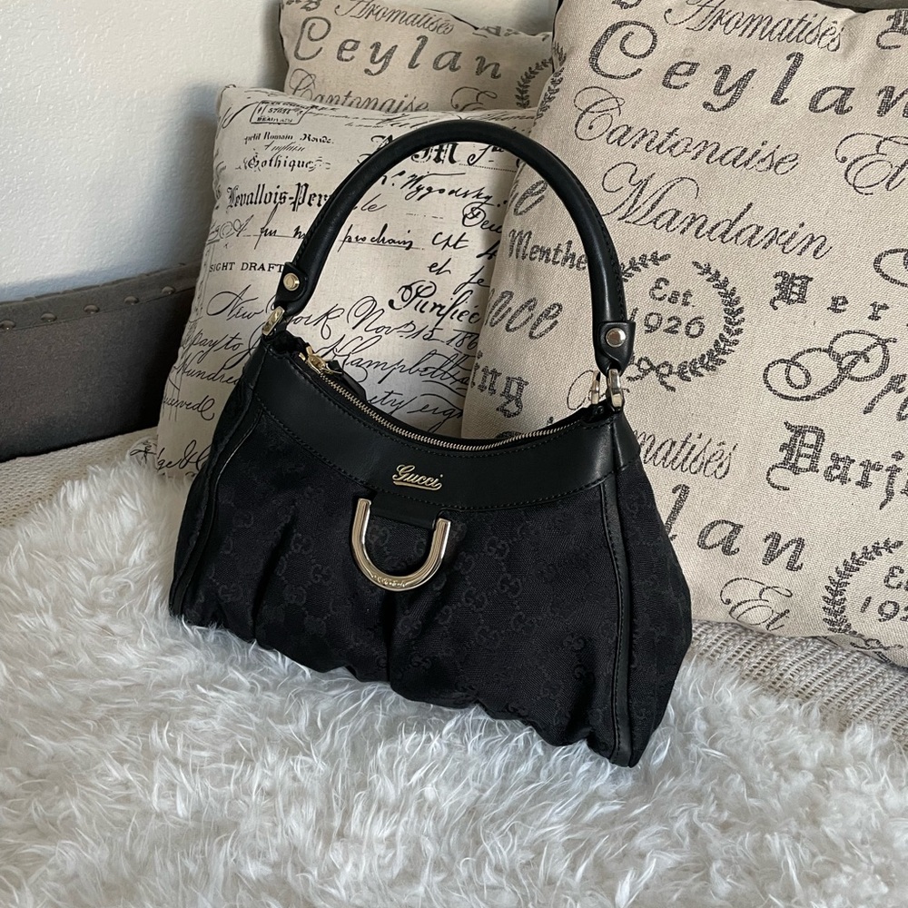 Authentic Gucci D Ring Hobo GG Canvas Small in black.